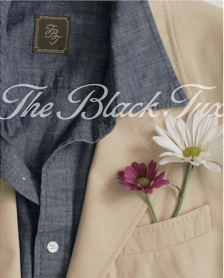 The Black Tux still life with a cream blazer, blue shirt, and white and purple flowers in the breast pocket
